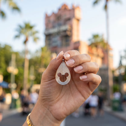 Mickey Mouse earrings with layered teardrop lines and 3D style.