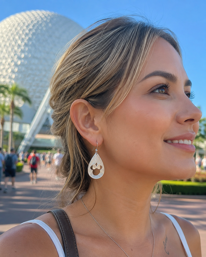 Minnie Mouse earrings with layered teardrop lines and 3D style.